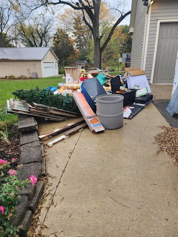 Dumpster being loaded with debris for 3 Yard Dumpster Rental in Hatboro